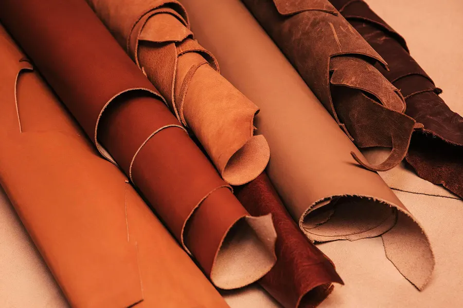 Rolled full-grain leather hides in the workshop